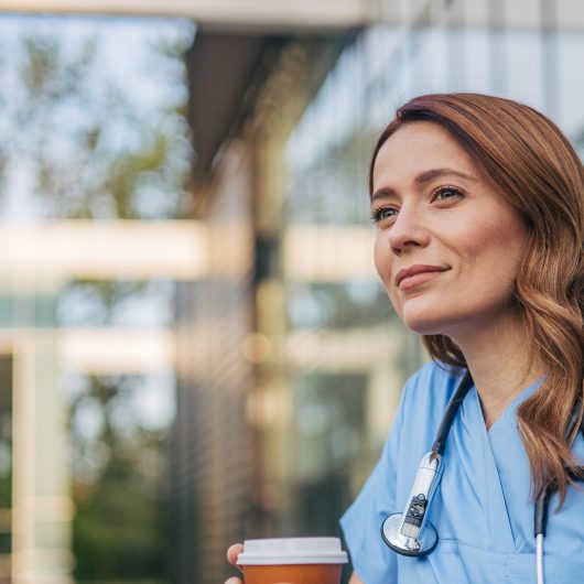 Nurse with holding cup