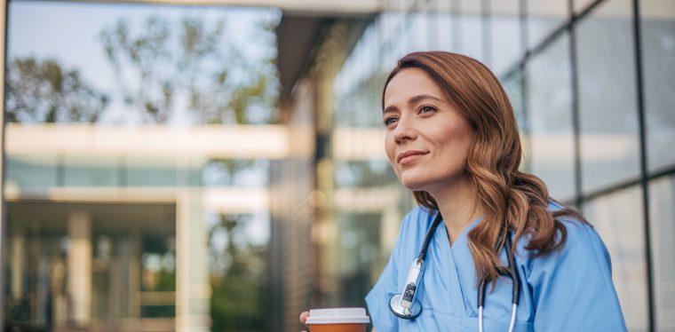 Nurse with holding cup