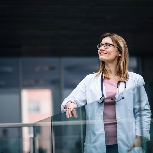 Doctor looking outside and enjoying the Scenery