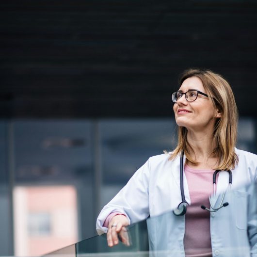 Doctor looking outside and enjoying the Scenery